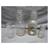 Four Glass Milk Bottles