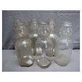 Six Glass Milk Bottles With Embossed Logos