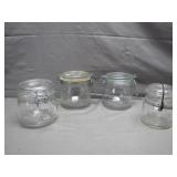 4 Glass Storage Jars with Lids, One is Atlas 4 Glass Storage Jars with Lids, One is Atlas