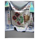 Hand-Stitched Floral Quilt with Basket Design Hand-Stitched Floral Quilt with Basket Design