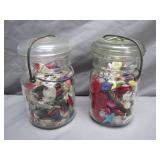 Two Glass Jars Filled With Buttons