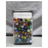 Glass Jar of Assorted Colorful Marbles