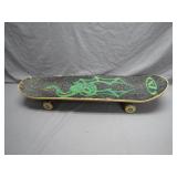 Classic Skateboard with Green Graphics