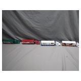 Four 1:64 Scale Racing Trucks