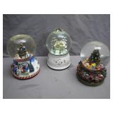 Three Christmas-Themed Snow Globes