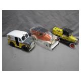 Three Diecast Model Cars with Boxes