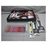 Cosmetics Collection With Brushes and Lip Glosses