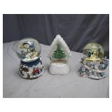 Three Holiday-Themed Snow Globes
