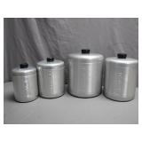 Four Metal Canisters with Lids