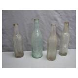 Four Early 20th-Century Glass Bottles