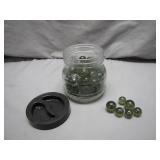 Clear Jar With Green Glass Marbles