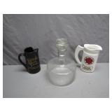 Two Whisky Jugs and a Glass Decanter
