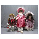 Three Porcelain Dolls with Costumes