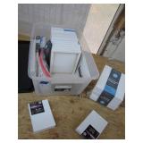 Plastic Bin Full of Stretched Canvases