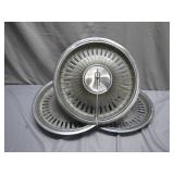 Three Oldsmobile Wheel Covers