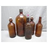 Five Brown Glass Bottles