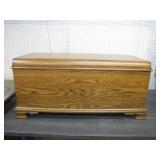 Wooden Chest with Hinged Lid and Carved Base