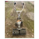 STIHL 2 STROKE TILLER W/ ROCK PUSHER ATT.