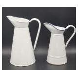 Two French White Enameled Pitchers