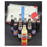 Collection of Pepsi Bottles and Blanket