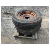 2- 11.25-24 Rib Tires on 8 Lug Wheel
