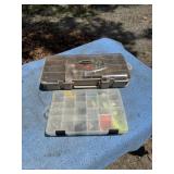 Tackle boxes full on fishing supplies