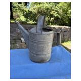 Galvanized metal watering can