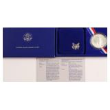 PROOF ELLIS ISLAND SILVER DOLLAR W BOX PAPERS