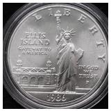 ELLIS ISLAND SILVER DOLLAR GEM