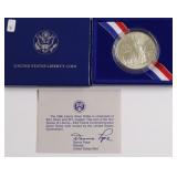 ELLIS ISLAND SILVER DOLLAR W BOX PAPERS