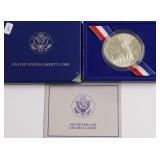 ELLIS ISLAND SILVER DOLLAR W BOX PAPERS