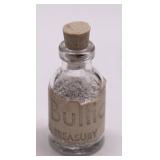 CONTAINER OF SILVER FLAKES