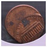 1986 MINT ERROR OFF CENTER LINCOLN CENT