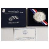 GEM LINCOLN SILVER DOLLAR W BOX PAPERS