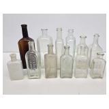 Early Embossed Glass Medicine Bottles