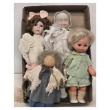 4 Assorted Dolls