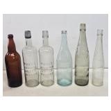 6 Large Early Embossed Glass Bottles