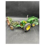 vintage John Deere toy tractor and 2-bottom plow