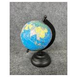 decorative miniature globe with a blue ocean map