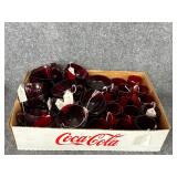 Assorted ruby red glass mugs and cups