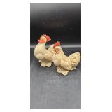 Rooster and hen ceramic figures.