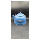 Blue speckled enamel ware tea kettle.