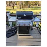 Weber Spirit gas grill and 20 lb propane tank