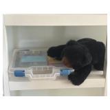 Art supplies and plush bear