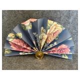 vintage folding fan featuring a floral pattern