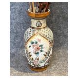 Cracked vase featuring raised hand painting