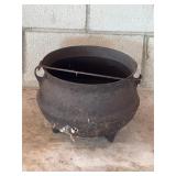 Flawed small antique cast-iron cauldron