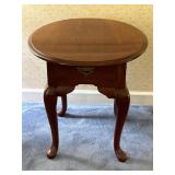 Vintage oval side table top has scratches