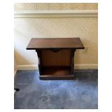 Side table with place for books