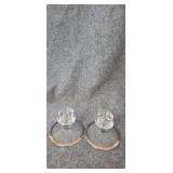 Pair of crystal candle holders with silver rim.